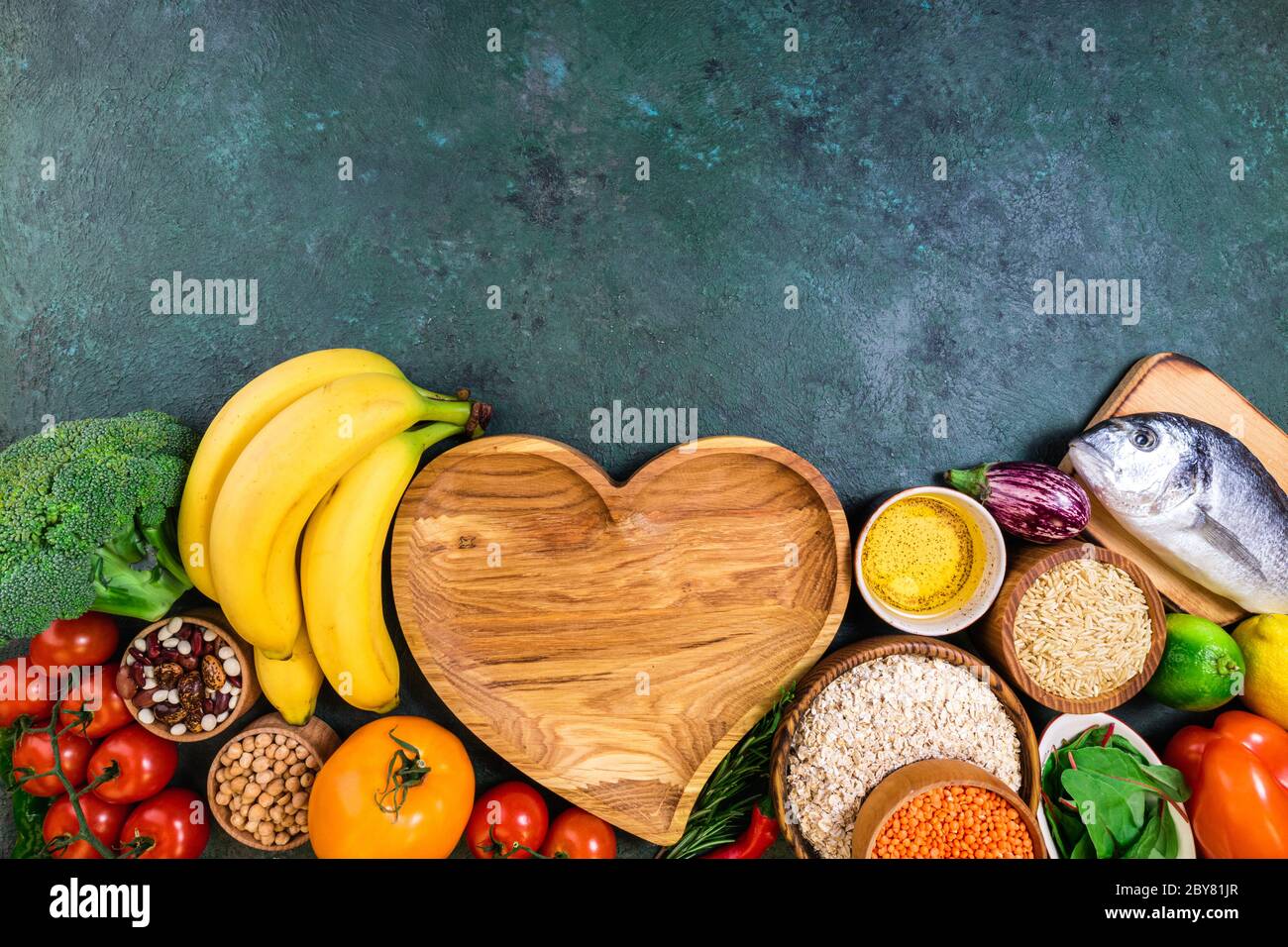 Background healthy food. Fresh fruits, vegetables, meat and fish on table. Eating for healthy heart. Healthy food, diet and healthy life concept. Top Stock Photo