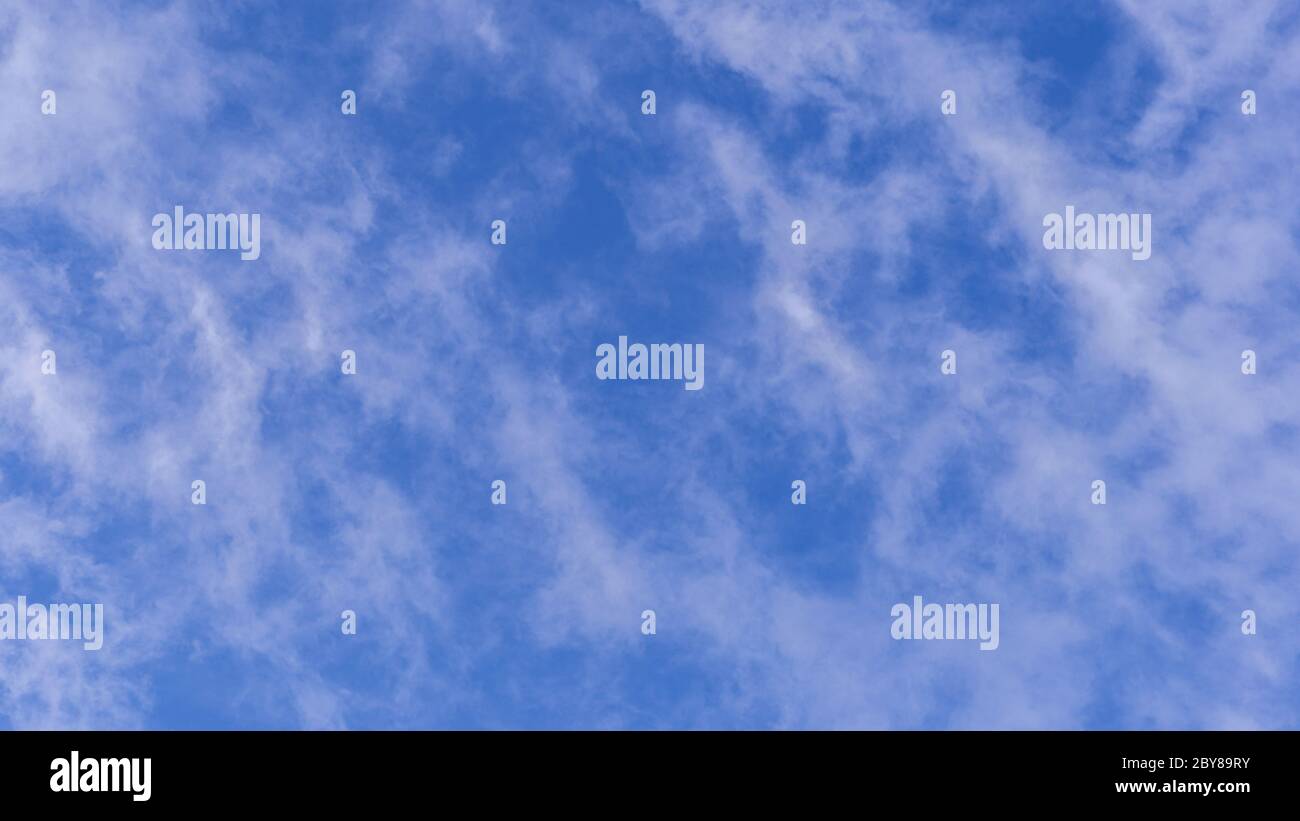 Blue sky background with white clouds on sunny day Stock Photo - Alamy