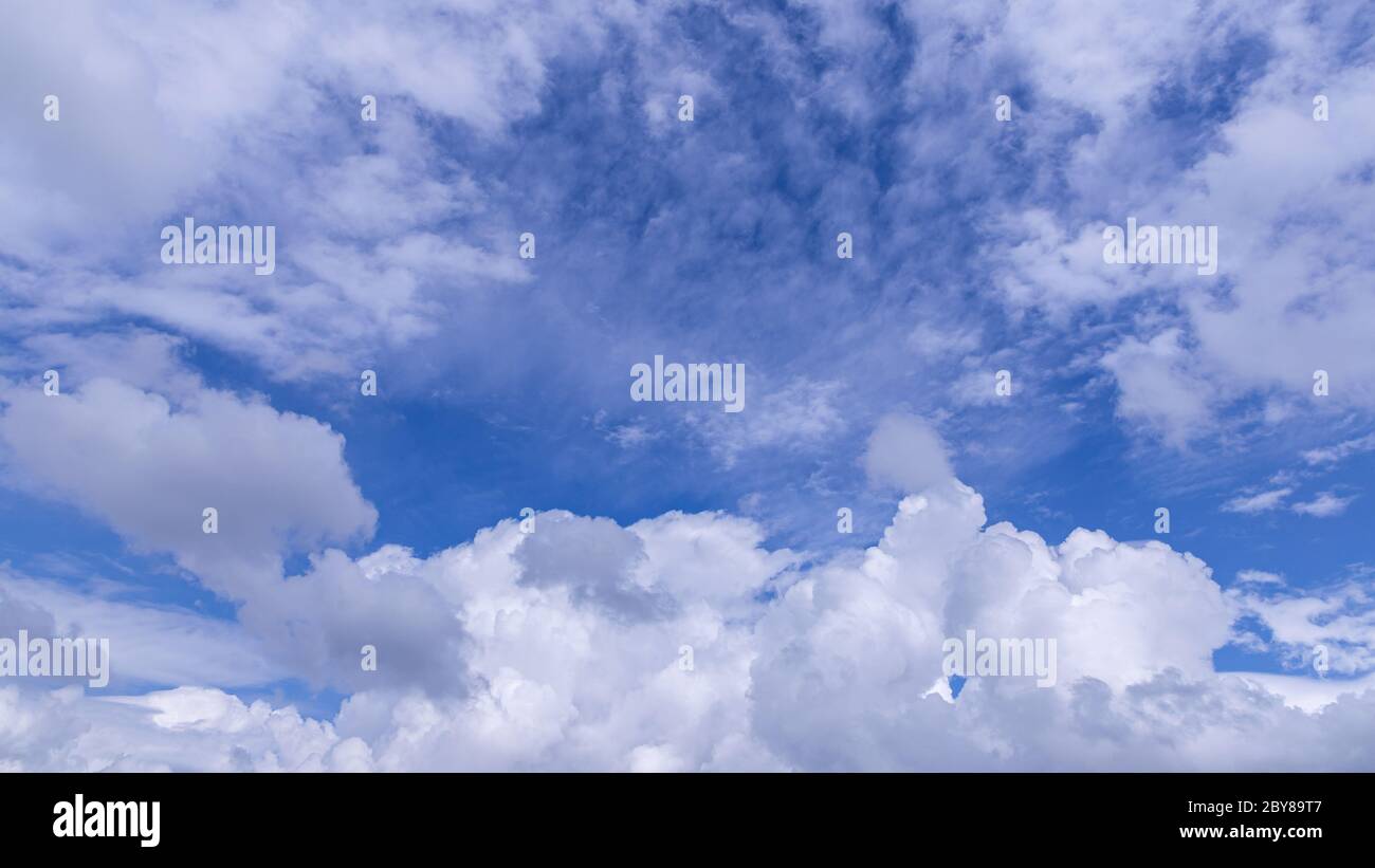 Blue sky background with white clouds on sunny day Stock Photo - Alamy