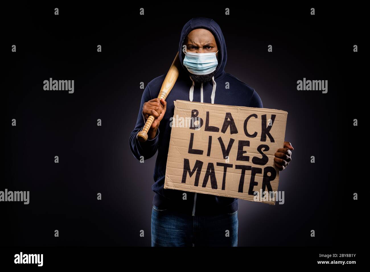 Photo Of Furious Afro American Guy Hold Cardboard Banner Ready Fight African People Equality Rights Have Baseball Beat Wear Sweater Jumper Medical Stock Photo Alamy