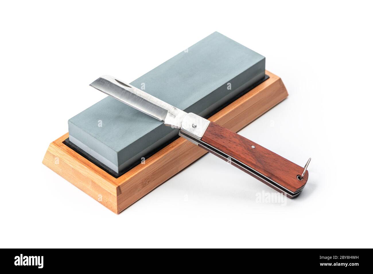 Jackknife and a whetstone isolated on white background Stock Photo