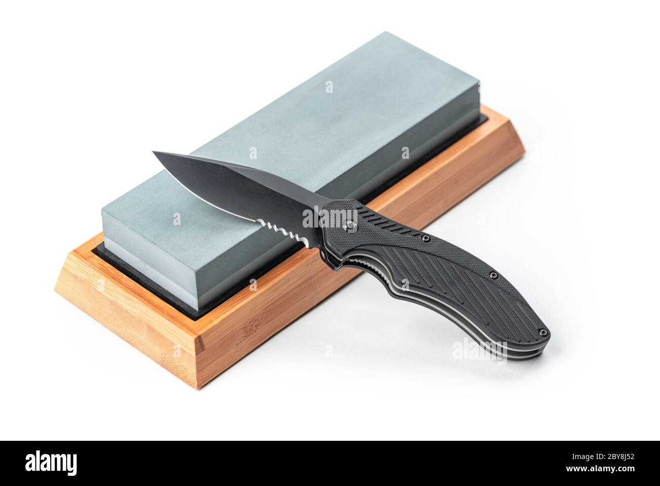 Folding pocket knife laying on a whetstone Stock Photo Alamy