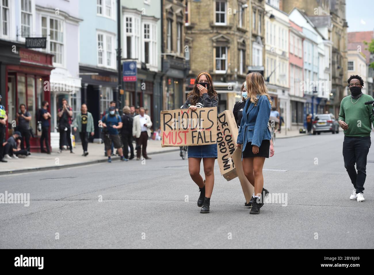 Protesters in Oxford High Street, Oxford, during a protest calling for the removal of the statue of 19th century imperialist, politician Cecil Rhodes from the Oriel college, Oxford, which has reignited amid anti-racism demonstrations. Stock Photo