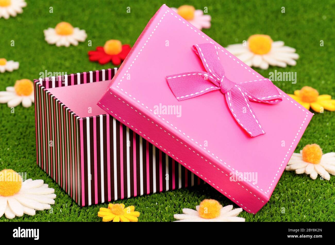 Gift box on grass Stock Photo Alamy