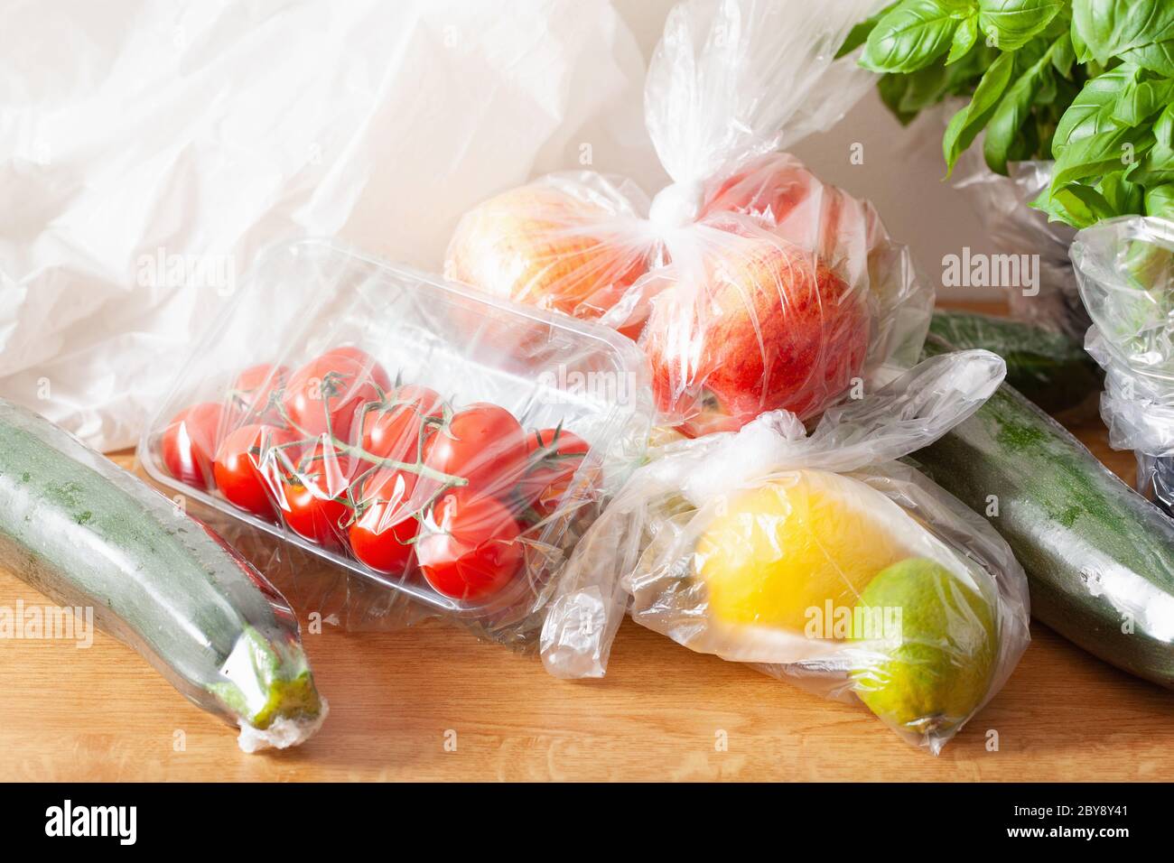 single use plastic waste issue. fruits and vegetables in plastic bags