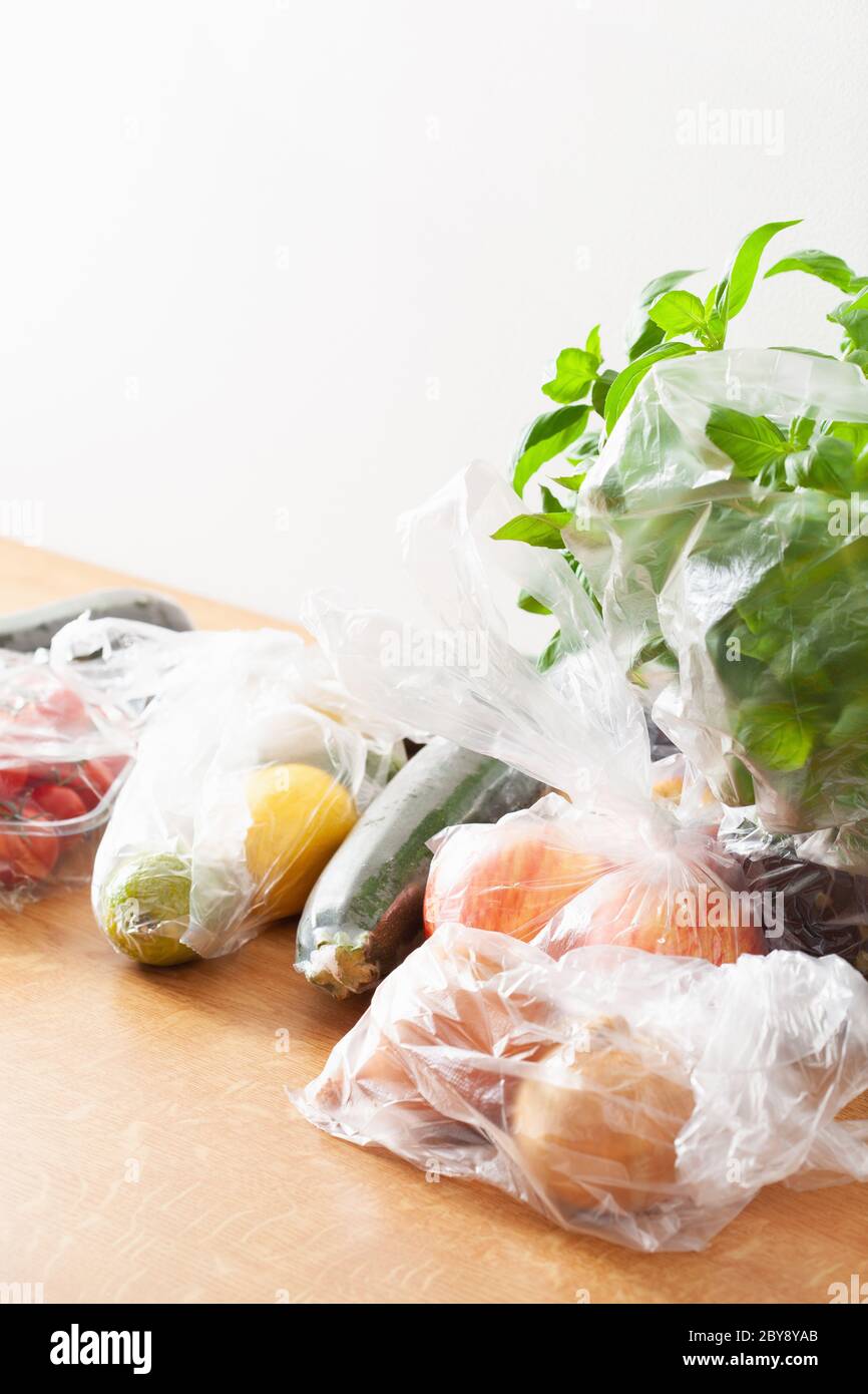 single use plastic waste issue. fruits and vegetables in plastic bags