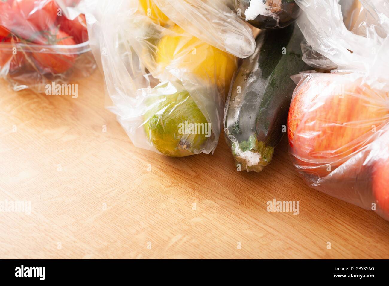 single use plastic waste issue. fruits and vegetables in plastic bags