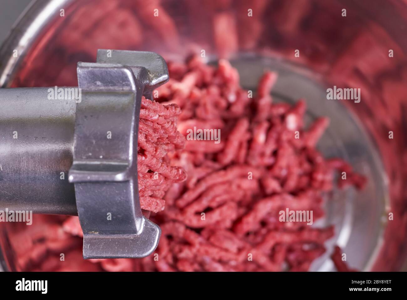 Electric Meat Grinder. Kitchen Tool To Mince Meat. Meat Grinding, Preparing  Food Ingredients. Vegan Worst Nightmare Stock Photo, Picture and Royalty  Free Image. Image 148241348.