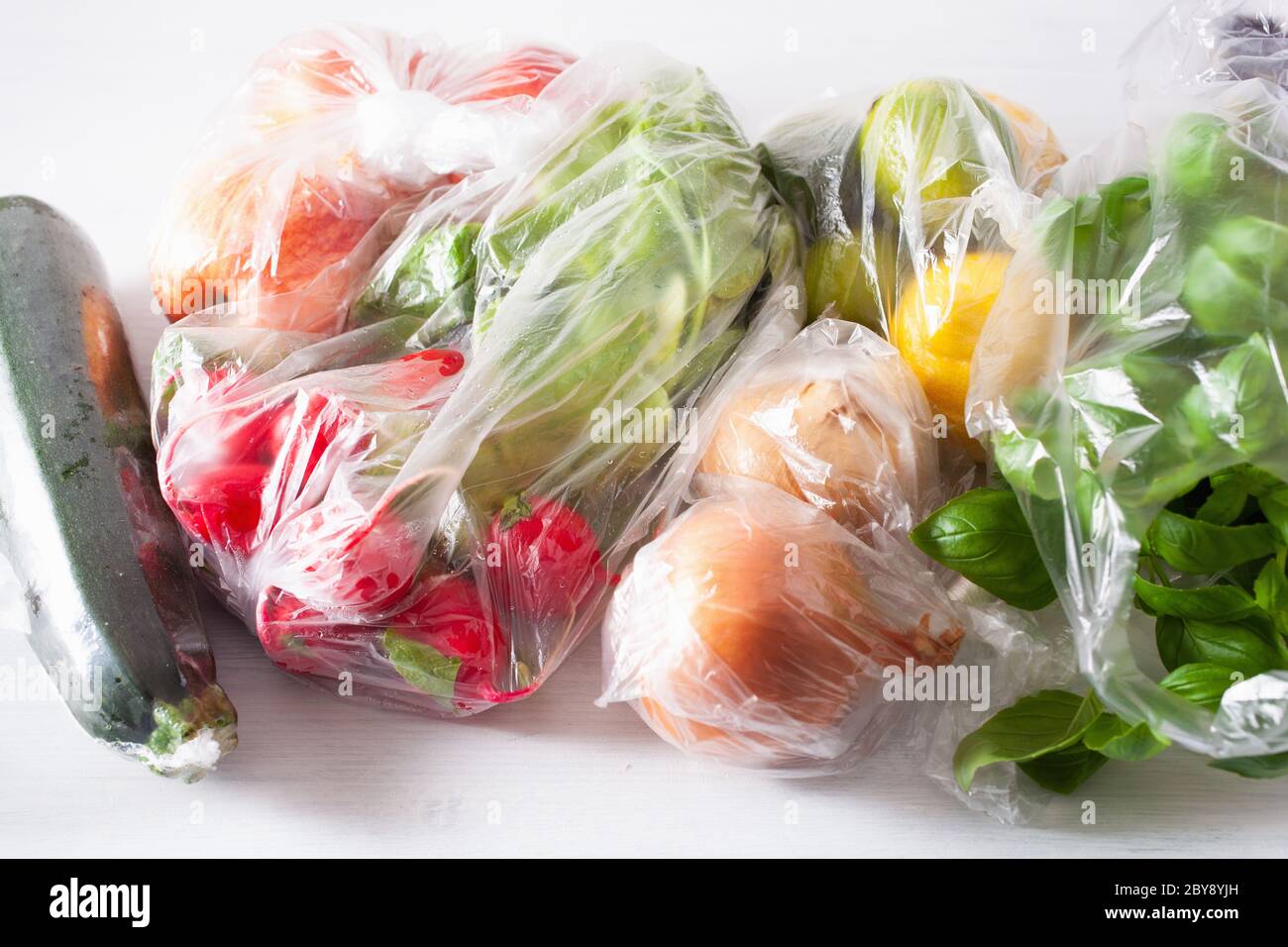 single use plastic waste issue. fruits and vegetables in plastic bags