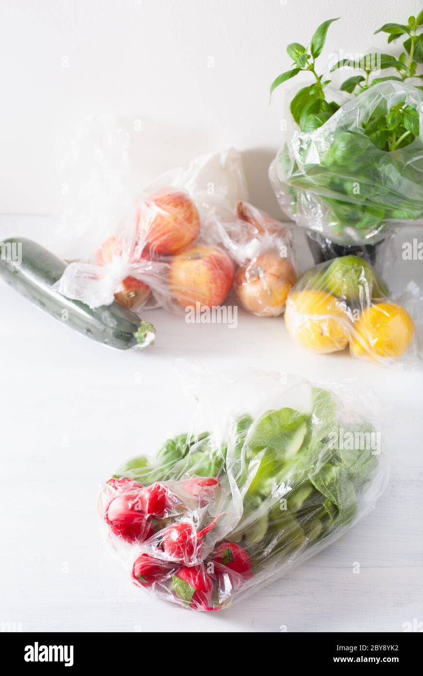 single use plastic waste issue. fruits and vegetables in plastic bags