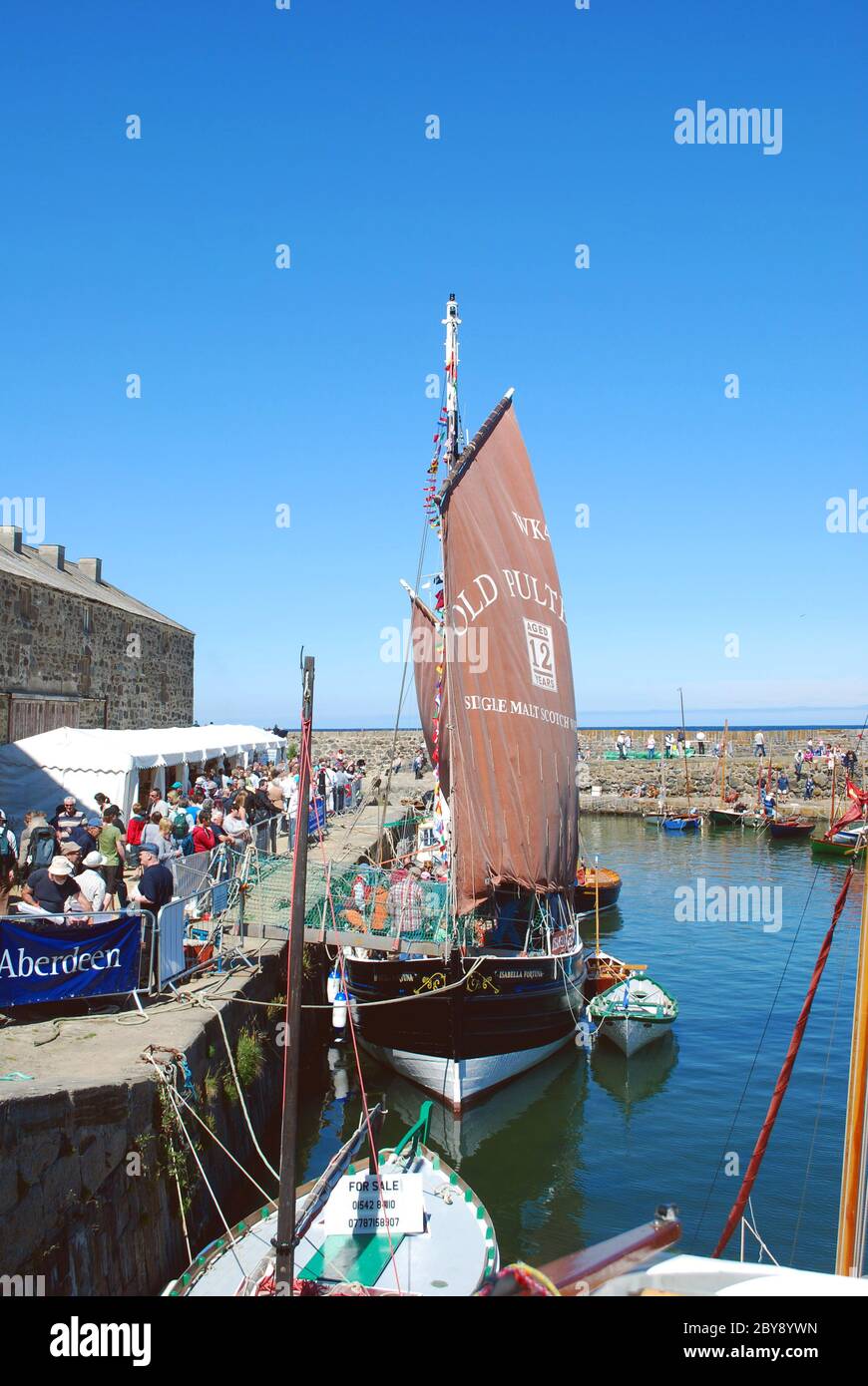 Portsoy Harbour in Aberdeenshire, Scotland, UK, busy with vessels for the annual Scottish Traditional Boat Festival weekend Stock Photo