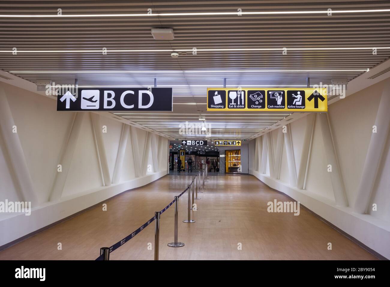 Airport direction signs in Rome Fiumicino Airport. Stock Photo