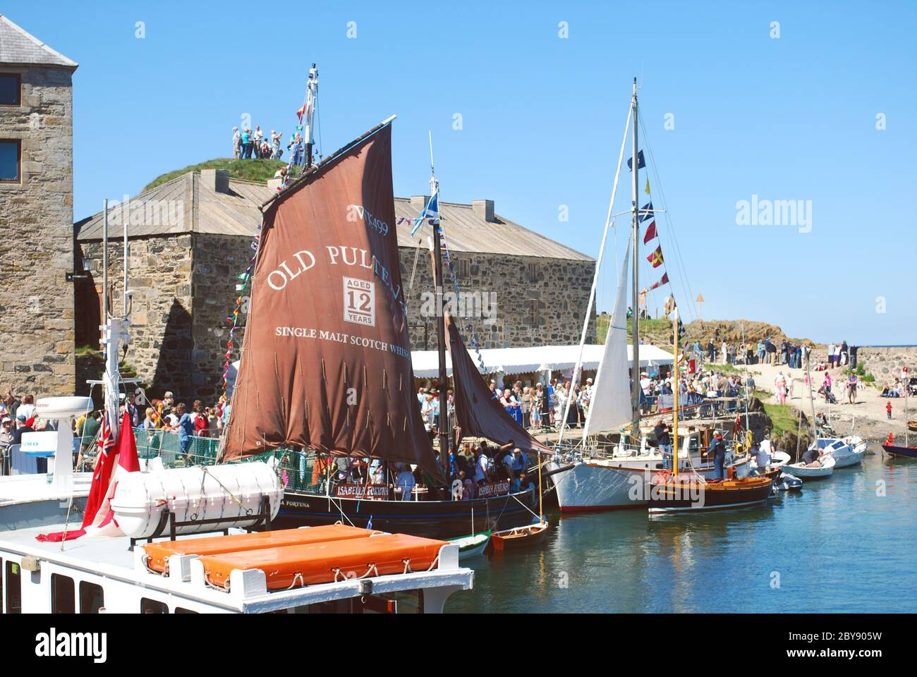 Portsoy Harbour in Aberdeenshire, Scotland, UK, busy with vessels for the annual Scottish Traditional Boat Festival weekend Stock Photo