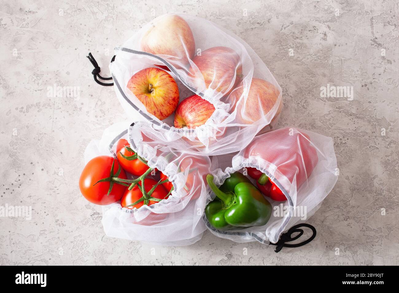 Apple fruit in plastic bag on wood table Stock Photo by ©jannystockphoto  77413662
