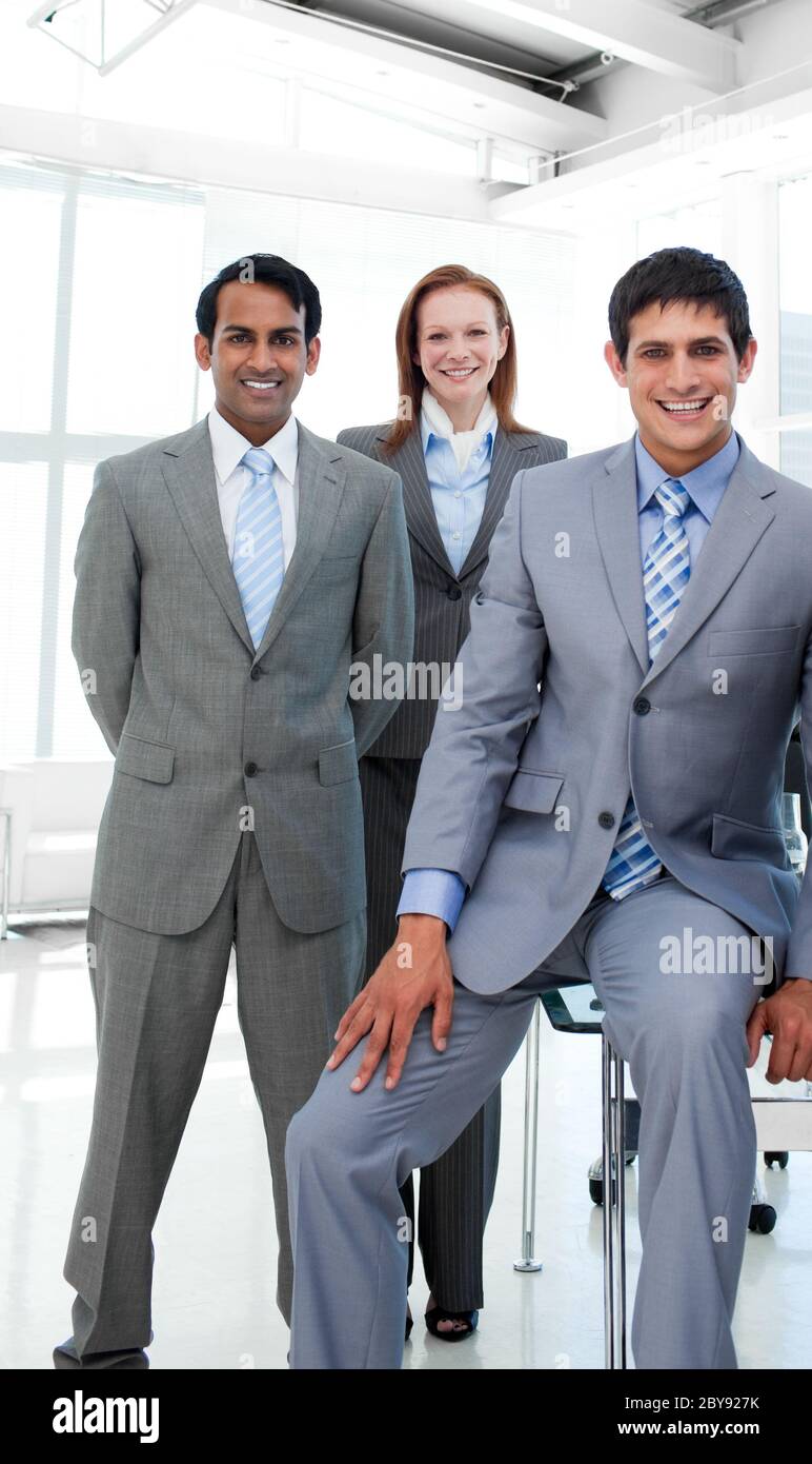 Business people in a line smiling at the camera Stock Photo - Alamy