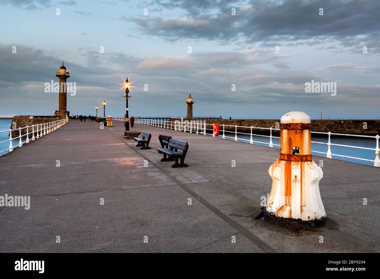 Pier and Lighthouse, Dusk, Whitby, England Stock Photo