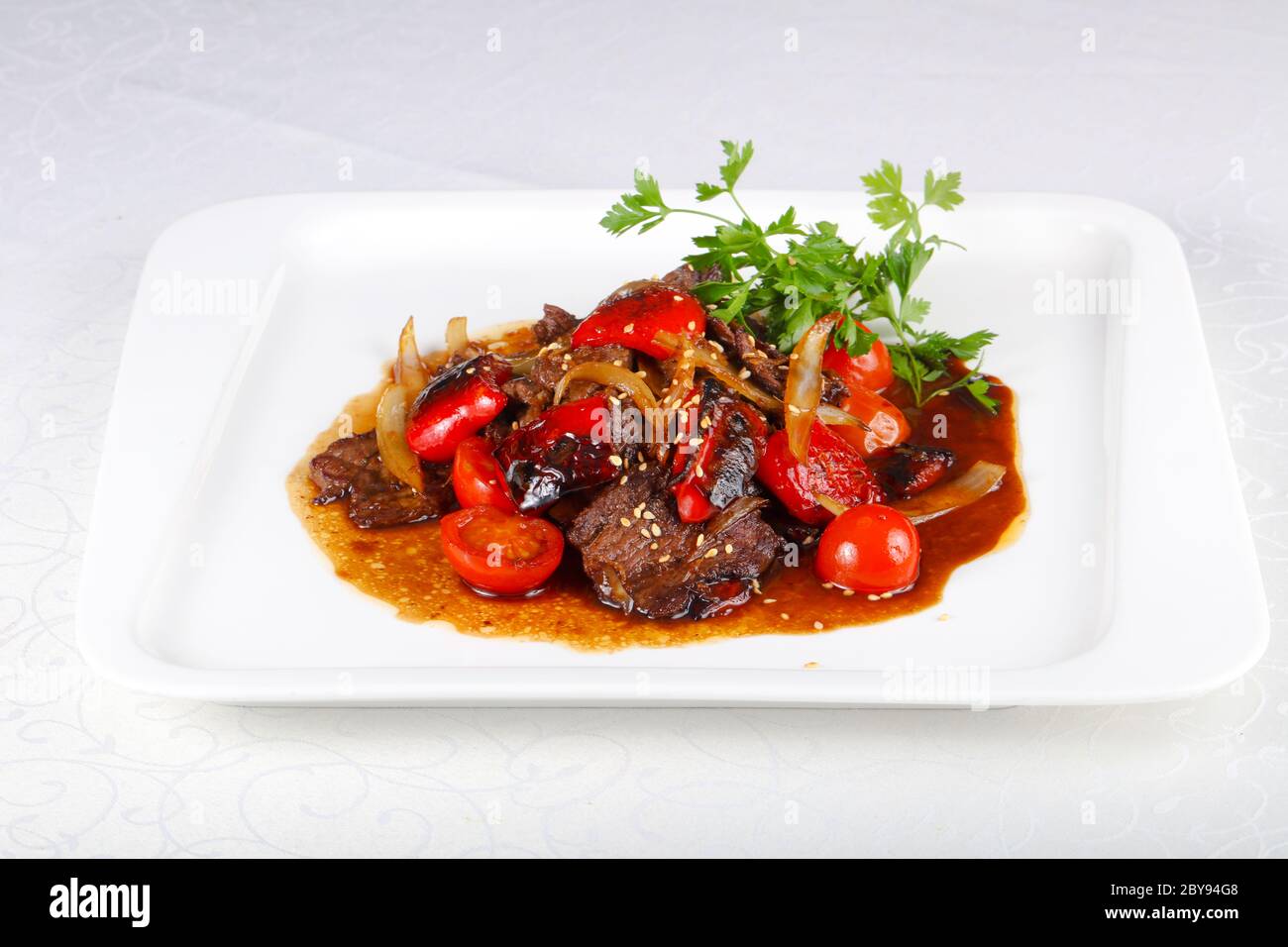 Beef in oyster sauce with tomato Stock Photo Alamy