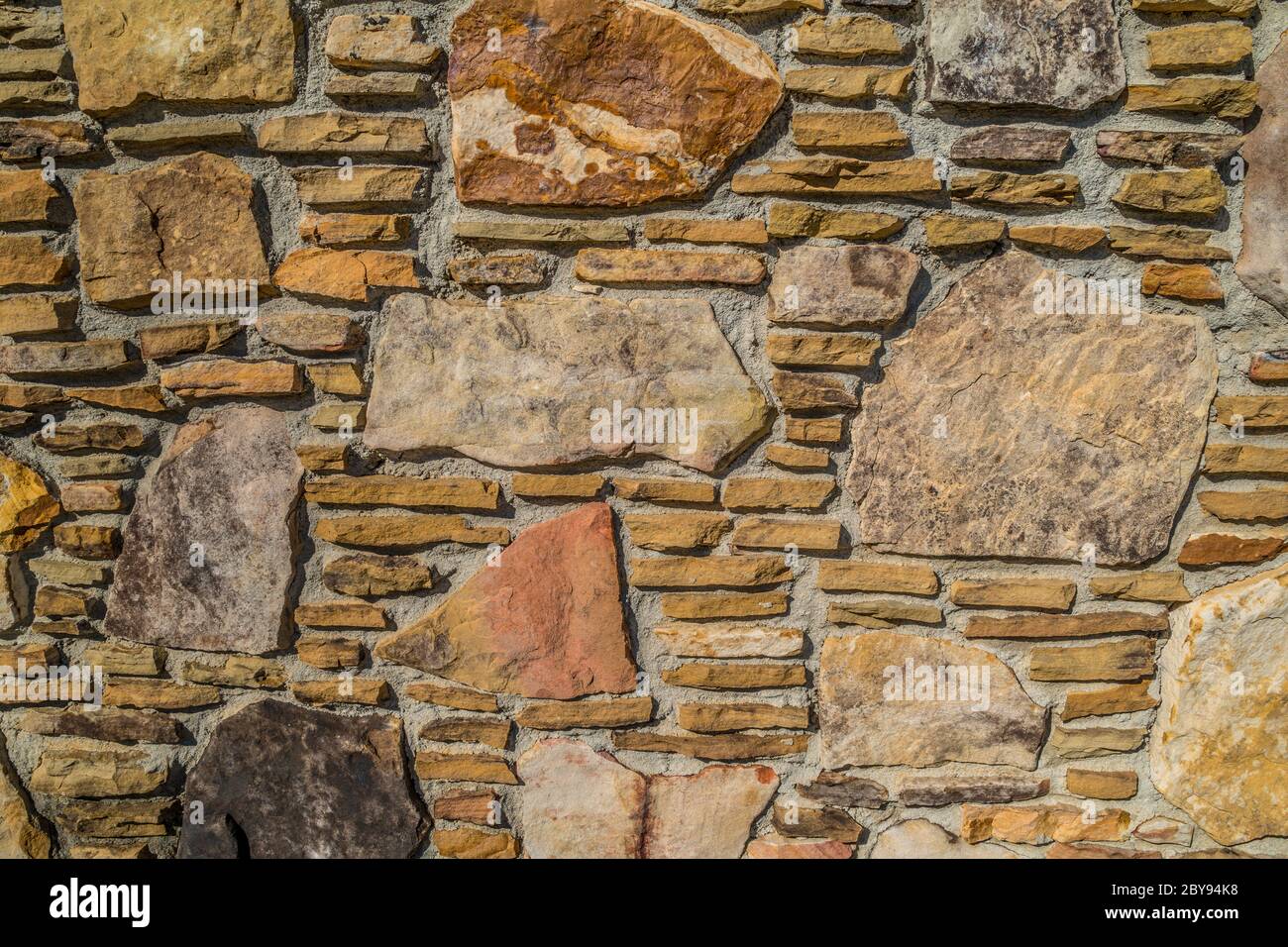 Variety of rocks in a stacked pattern with different shapes and sizes ...