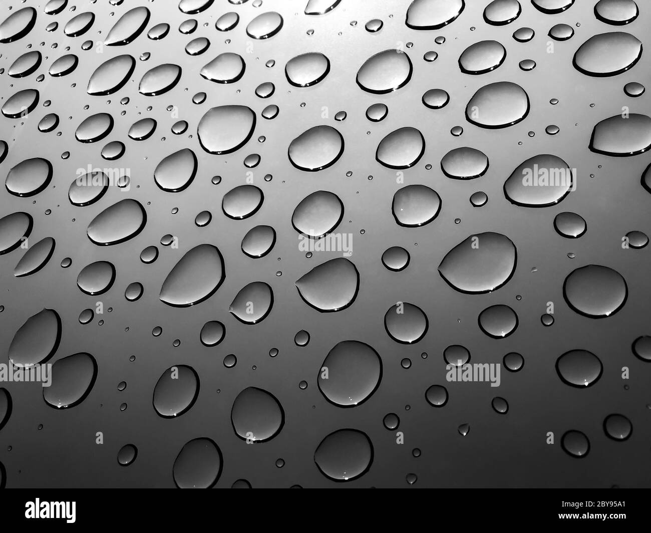 Water drops through the window after the rain. Stock Photo