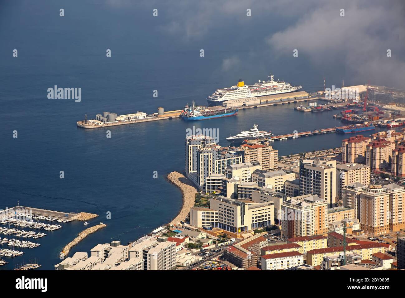 View from the Rock of the city below, the commercial port & also cruise ships in port, Gibraltar. Stock Photo