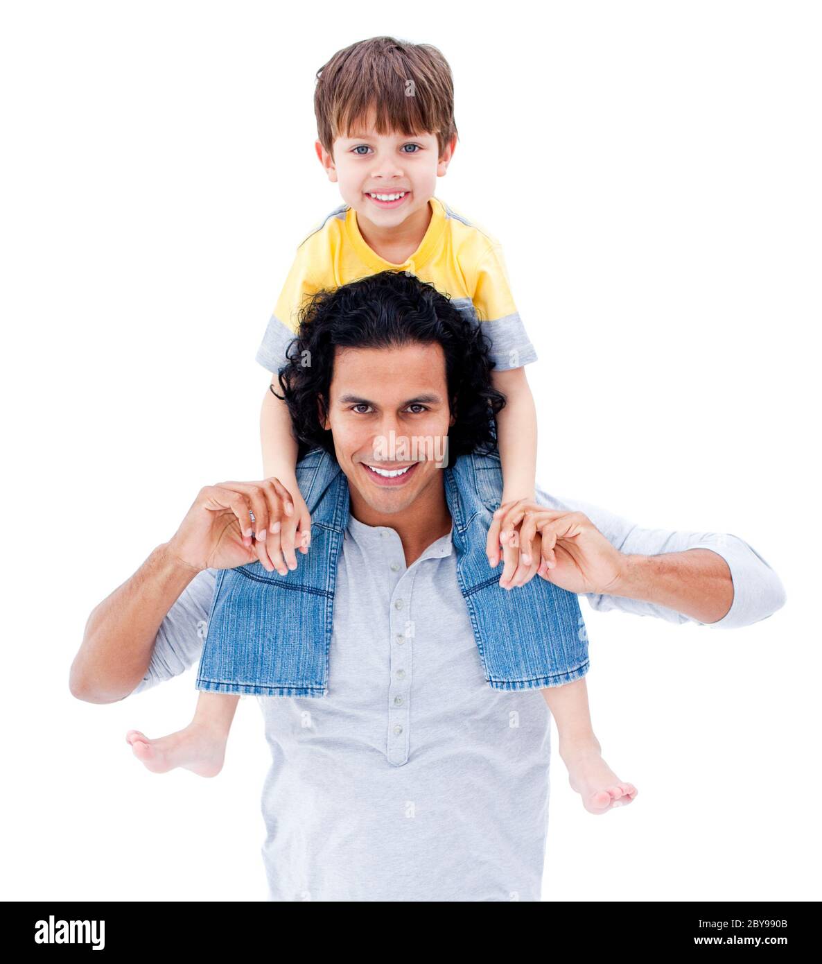 Man giving boy piggyback ride Man giving boy piggy back ride against white  background, model