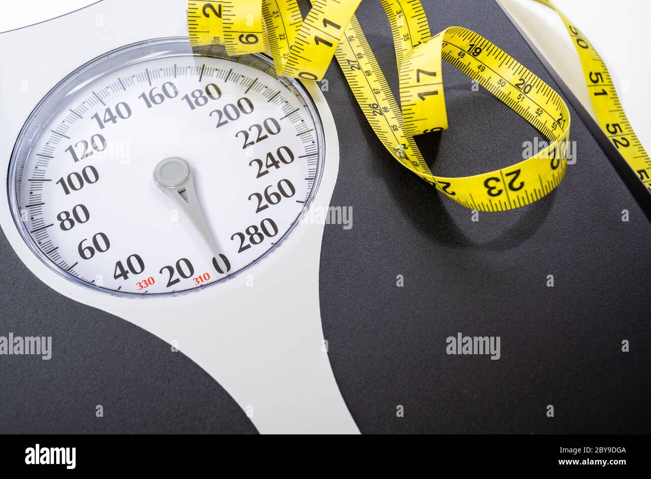 Human weight Dial measuring scale and measuring tape  Stock Photo