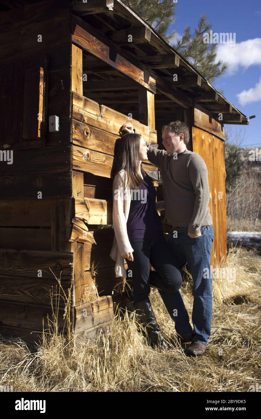 old barn with a young couple in love Stock Photo