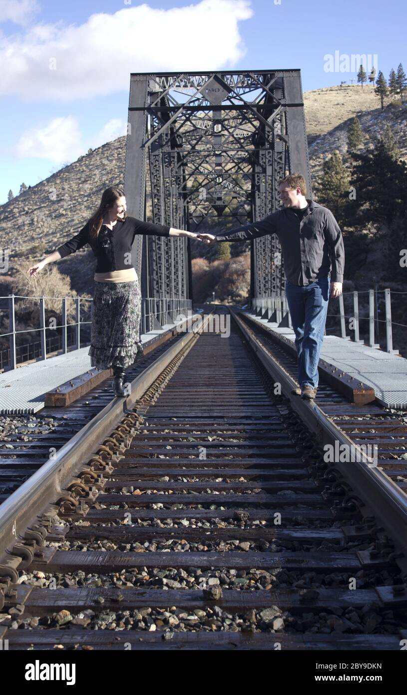 Young couple on train tracks hi-res stock photography and images - Alamy