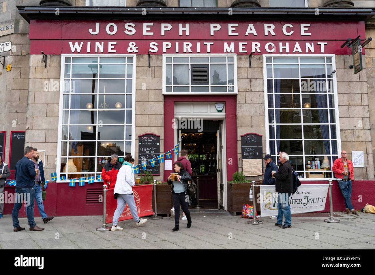 Edinburgh, Scotland, UK. 9 June 2020.  Joseph Pearce pub on Leith Walk is open for drinks to takeaway from the door. Iain Masterton/Alamy Live News Stock Photo
