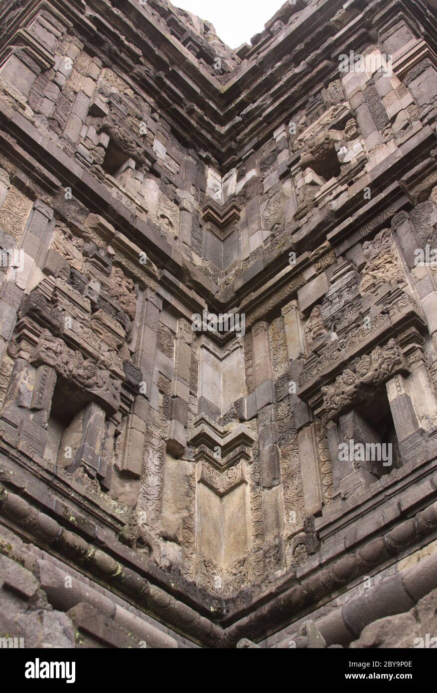 Stone carved detail at famous Prambanan hindu temple, Yogyakarta, Java, Indonesia. Candi Prambanan - Stone structures and rubble at iconic travel dest Stock Photo