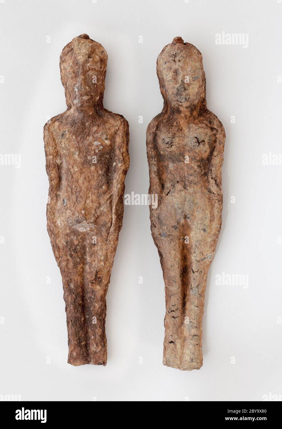 Effigies of Male and Female Couple Made of Fossilised Root Stock Photo