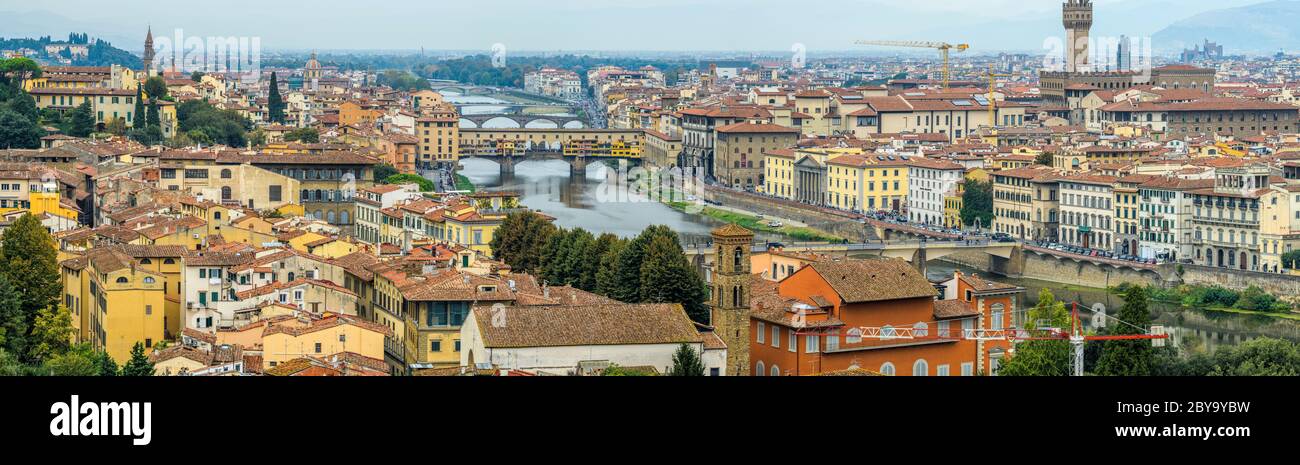 Autumn in Florence - Panoramic overview of Old Town of Florence, along side of Arno River, as seen from Piazzale Michelangelo on a rainy Autumn day. Stock Photo