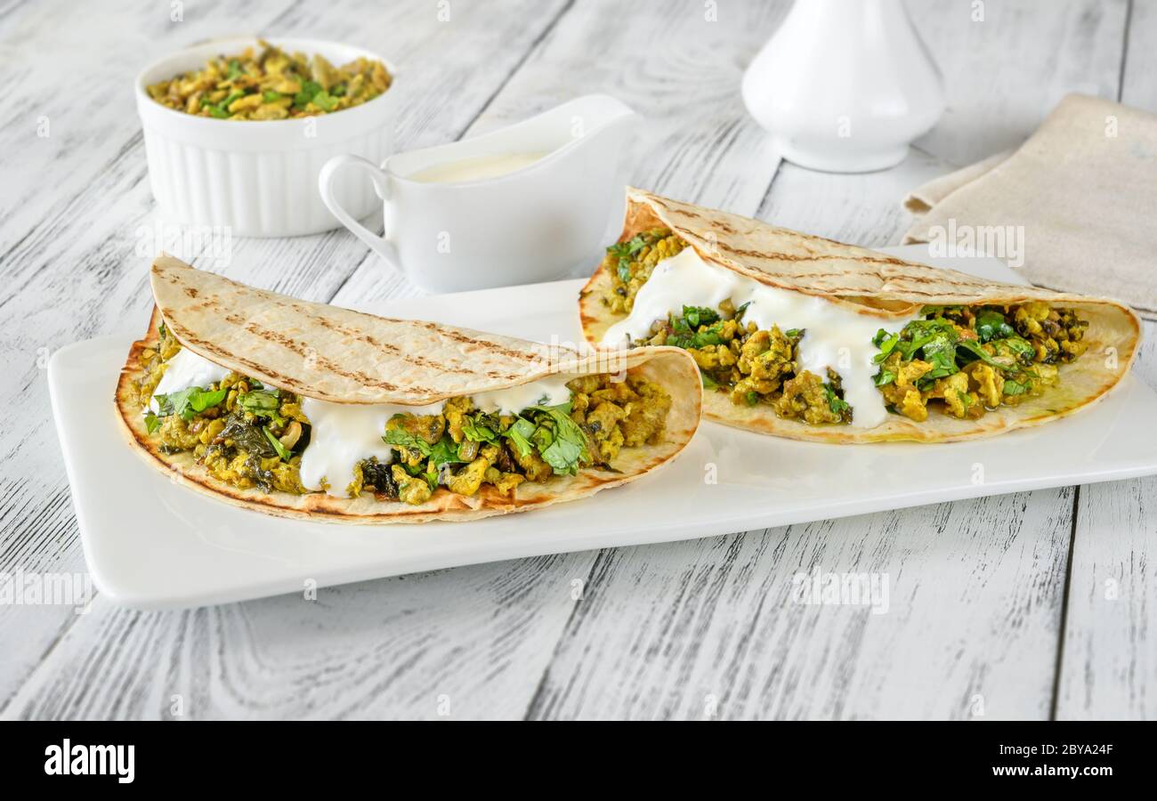 Indian spicy egg and spinach wraps Stock Photo Alamy