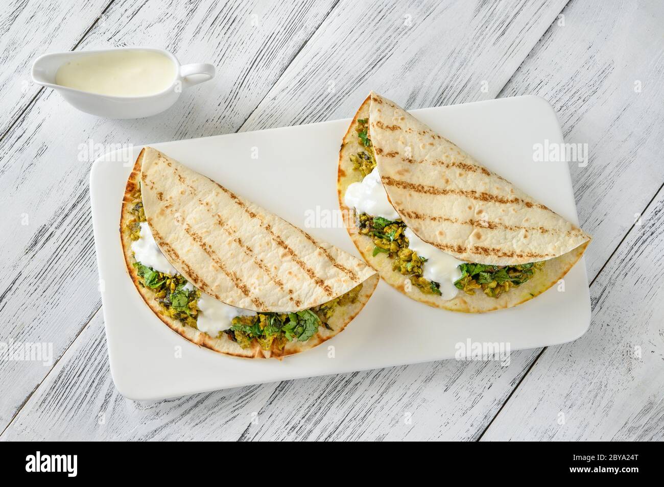Indian spicy egg and spinach wraps Stock Photo Alamy