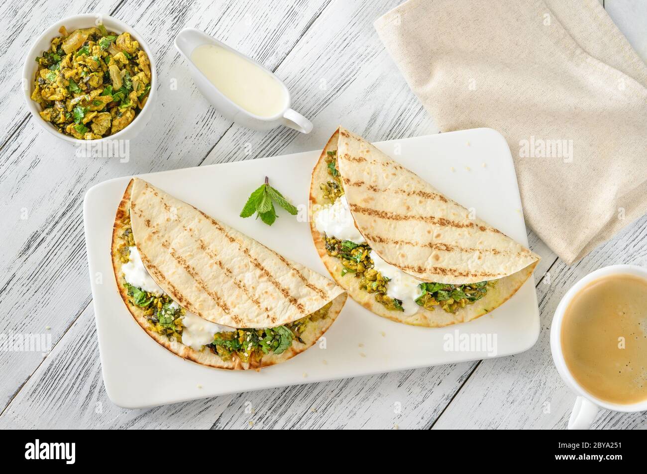 Indian spicy egg and spinach wraps Stock Photo Alamy