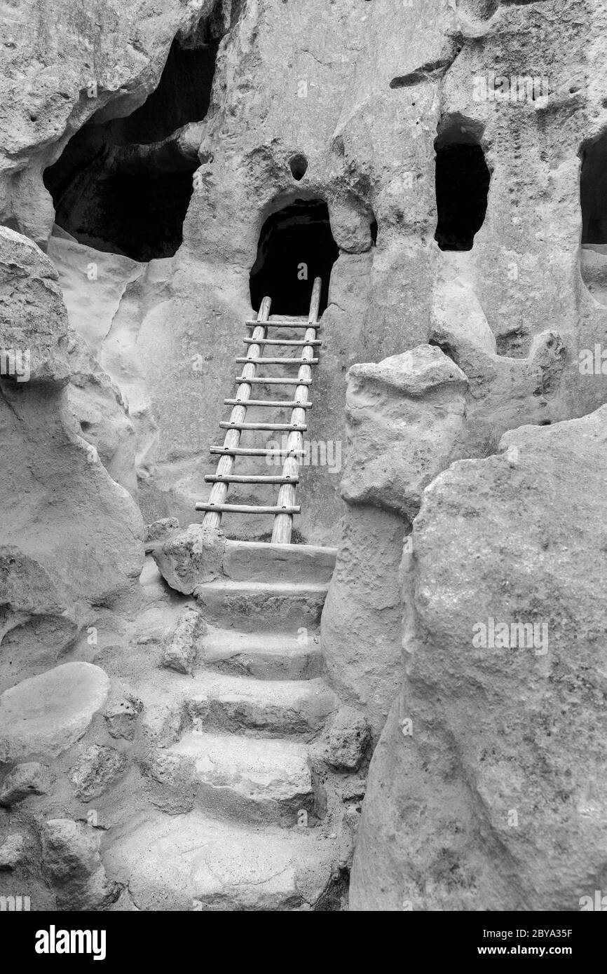 NM00617-00-BW...NEW MEXICO - Cliff dwellings, talus houses, along the Main Loop Trail in Bandelier National Monument. Stock Photo