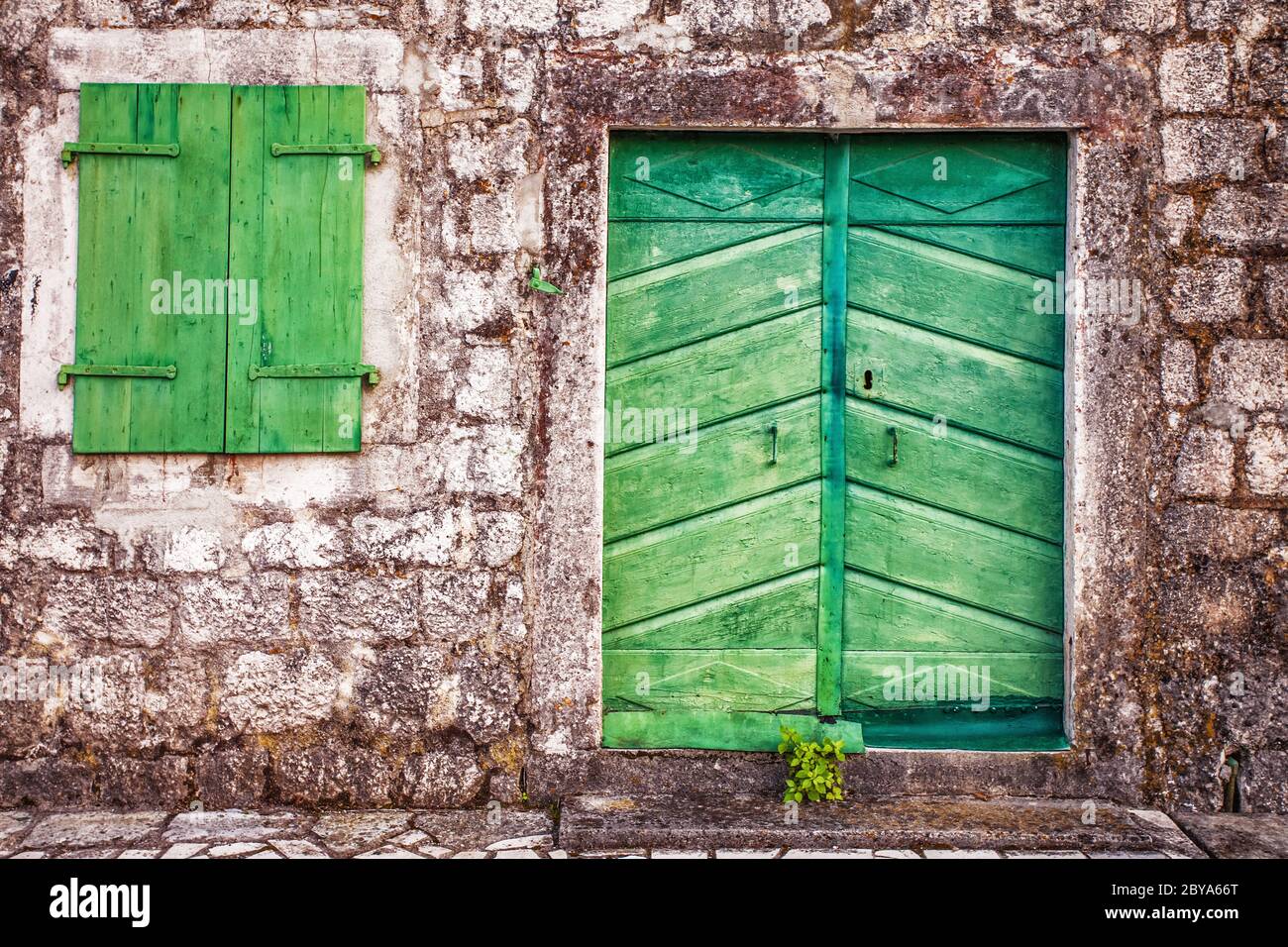 Old wall with door and windows Stock Photo - Alamy