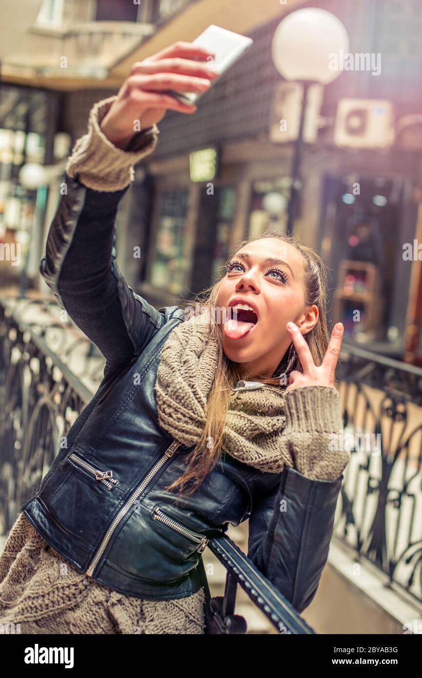 Pretty student girl taking a selfie with her cell phone Stock Photo - Alamy