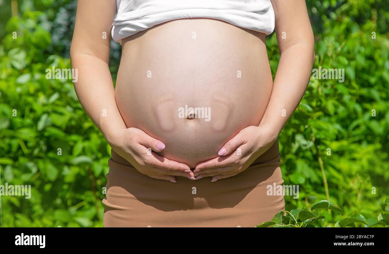 Belly of a pregnant woman legs baby. Selective focus. Selective focus.  people Stock Photo - Alamy