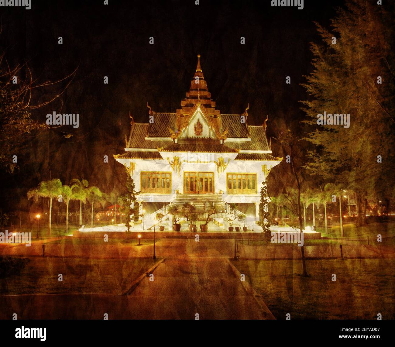 Thai temple at night in grunge style Stock Photo - Alamy