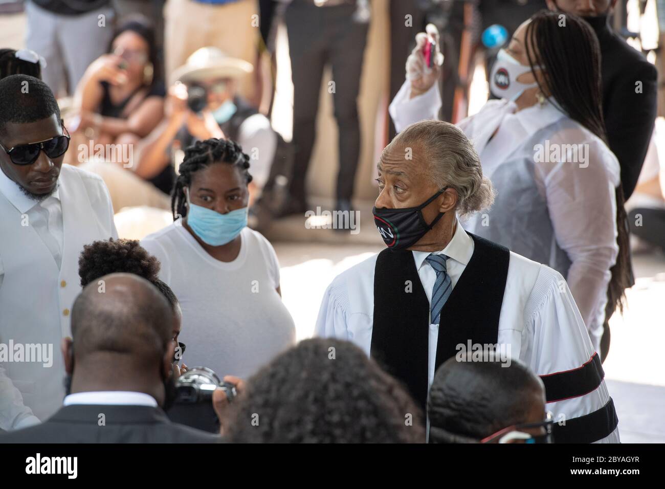 Family members along with Reverend AL Sharpton prepare to enter the sanctuary of Fountain of Praise Church in Houston on June 9, 2020 for the funeral service honoring the life of GEORGE FLOYD. Floyd 's death 2 weeks ago at the hands of a white policeman, set off hundreds of protests worldwide against police brutality and racism. Stock Photo