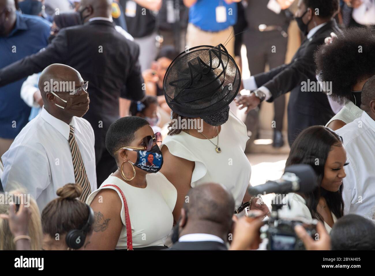 Family members and friends prepare to enter the sanctuary of Fountain of Praise Church in Houston on June 9, 2020 for the service honoring the life of GEORGE FLOYD. Floyd 's death in late May by a white policeman set off hundreds of protests worldwide against police brutality and racism. Stock Photo
