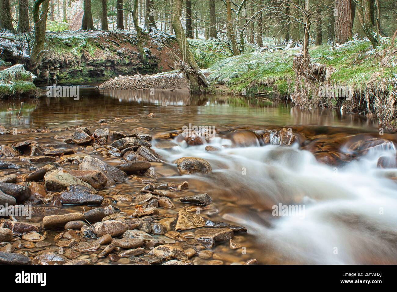 Derwent Valley. Stream running into Howden Reservoir, on a cold winter day. Stock Photo