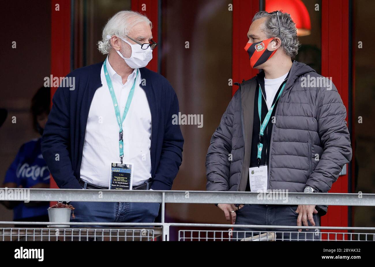 09 June 2020, Saarland, Völklingen: Football: DFB Cup, 1st FC Saarbrücken - Bayer Leverkusen, semi-finals: Rudi Völler (l), Managing Director Sports of Bayer Leverkusen, before the match. (Important note: The DFB prohibits the use of sequence images on the Internet and in online media during the match (including half-time). Embargoed period! The DFB permits the publication and further use of the images on mobile devices (especially MMS) and via DVB-H and DMB only after the end of the game). Photo: Ronald Wittek/epa Pool /dpa Stock Photo