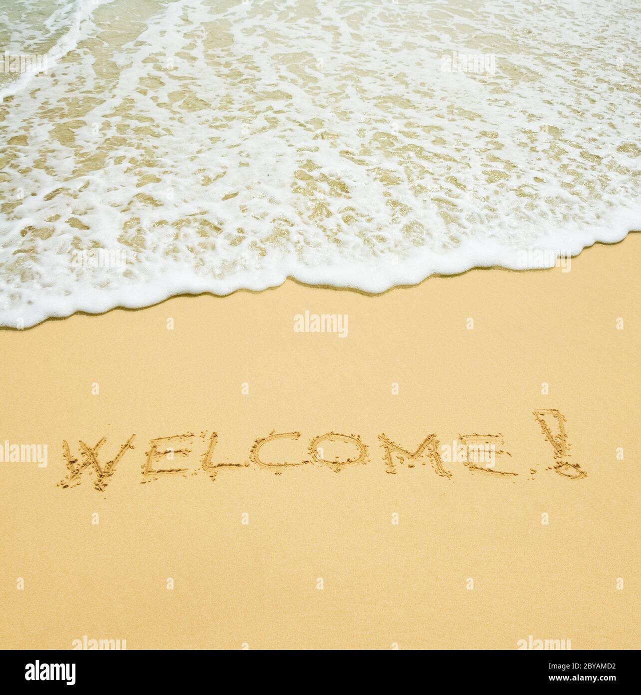 welcome written in a sandy tropical beach Stock Photo