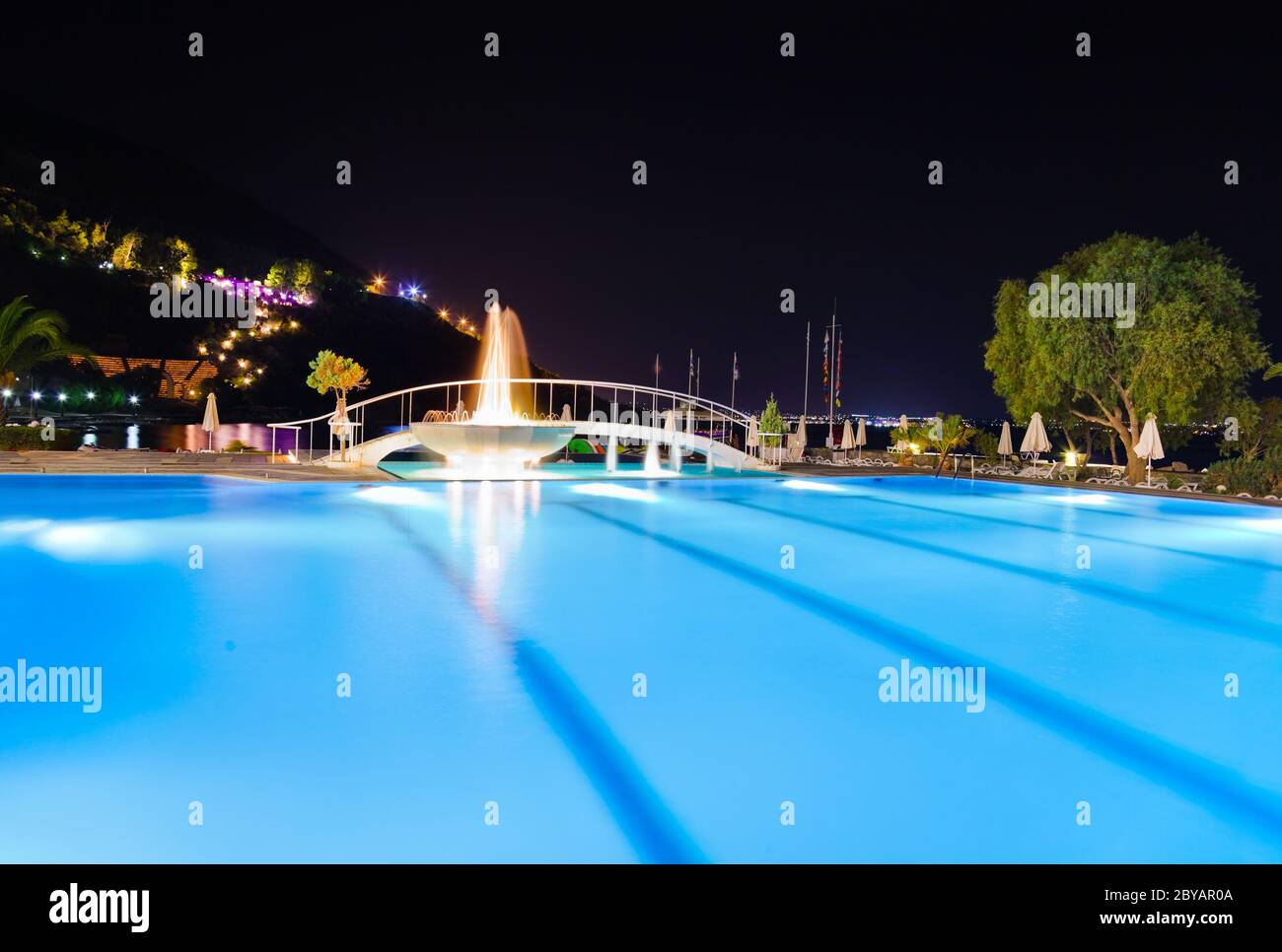 Water pool and fountain at night Stock Photo - Alamy