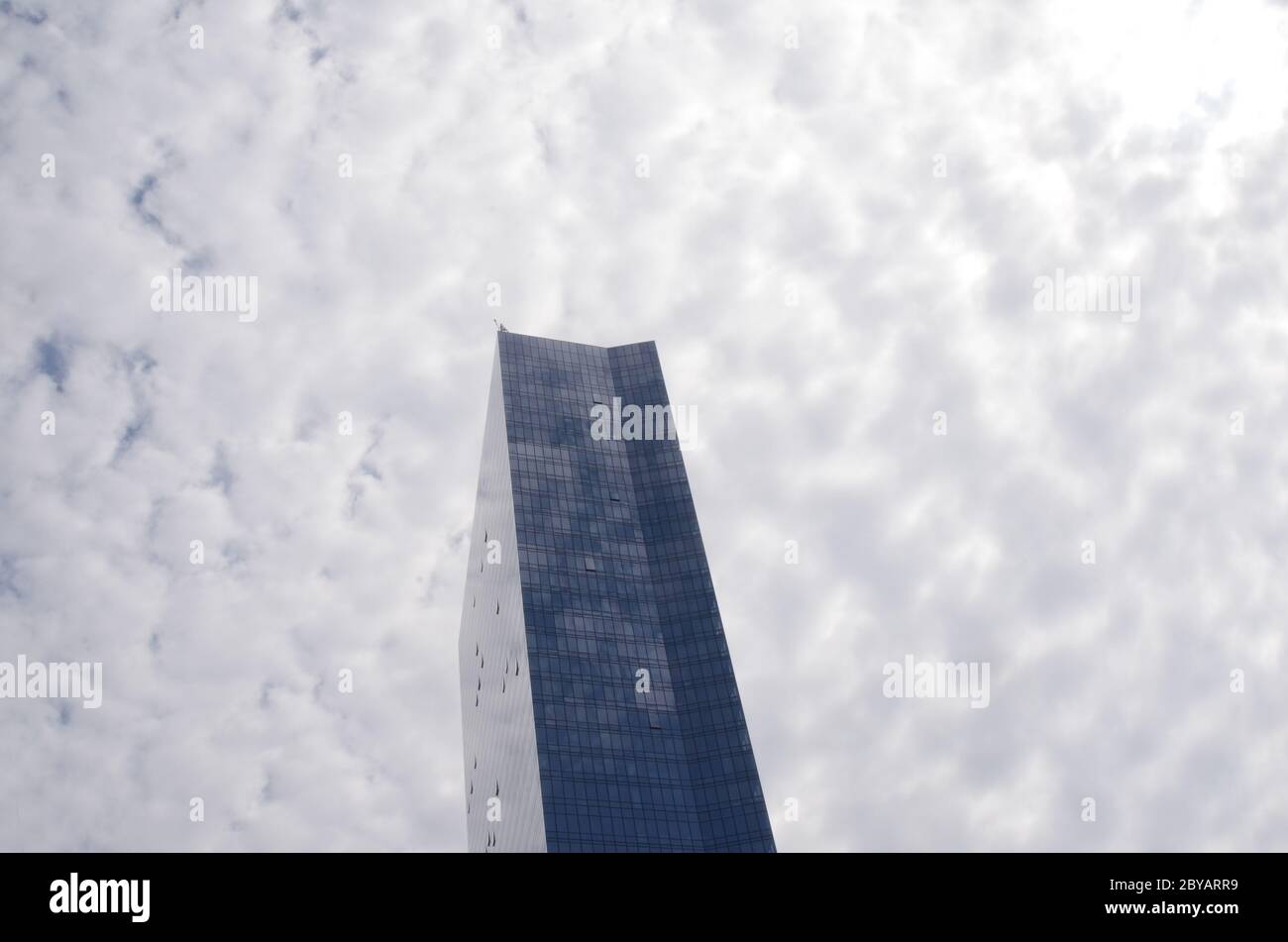 TOWER ONE: A single luxury high rise apartment building stands tall into the heavens sky above Fort Lee just before the George Washington Bridge. Stock Photo