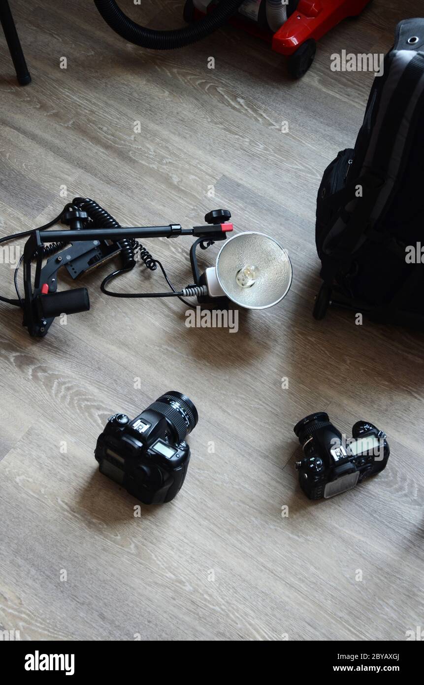 PHOTOSHOOT: Photography equipment sits on the floor of an apartment. Stock Photo