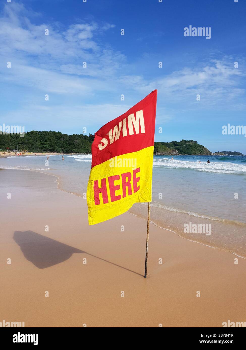 Swimming here sign flaf for security information on the beach Stock Photo