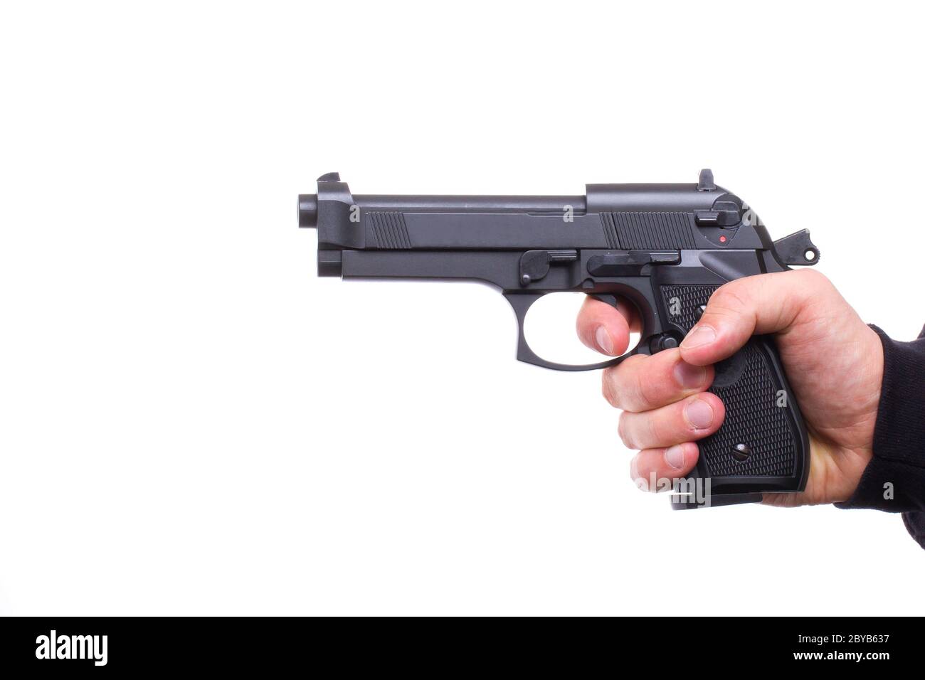 Pistol in hand Stock Photo - Alamy